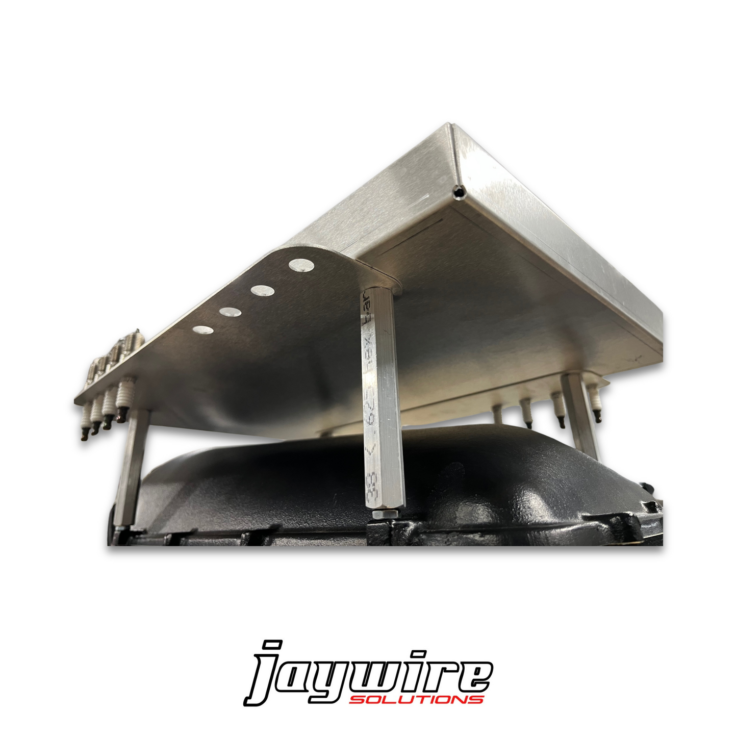 Metallic automotive part with 'jaywire solutions' branding on a white background